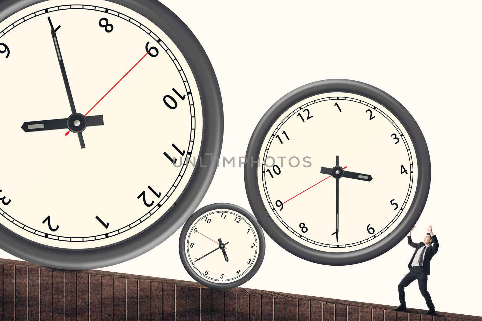 Time pressure concept, Asian business man face the rolling clock.