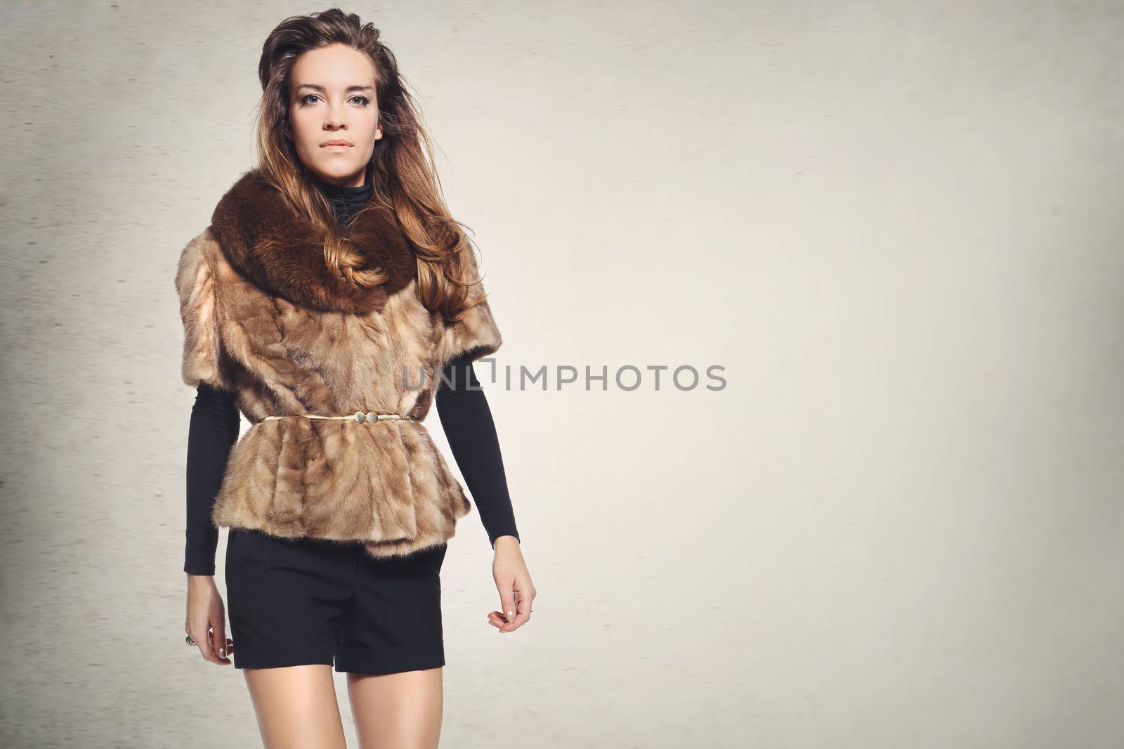 Mysterious elegant woman in a fur coat and sunglasses by robert_przybysz