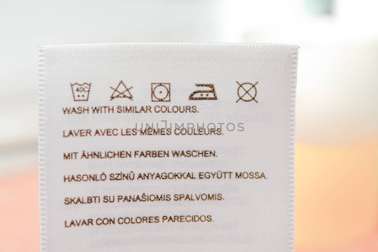 Clothes label with cleaning instructions. Close up.