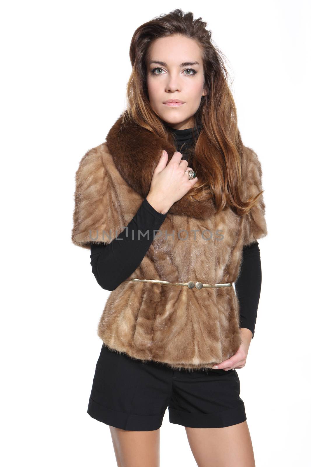 Fashion model in a fashionable vest with fur