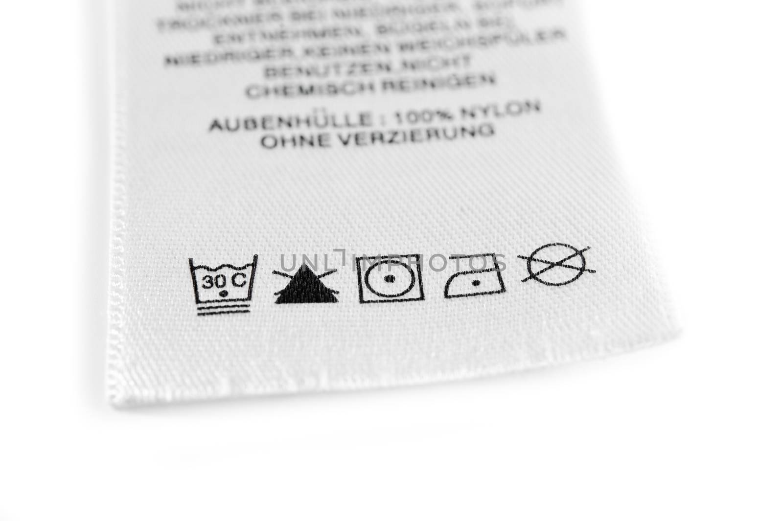 Close up view on an isolated washing label tag.