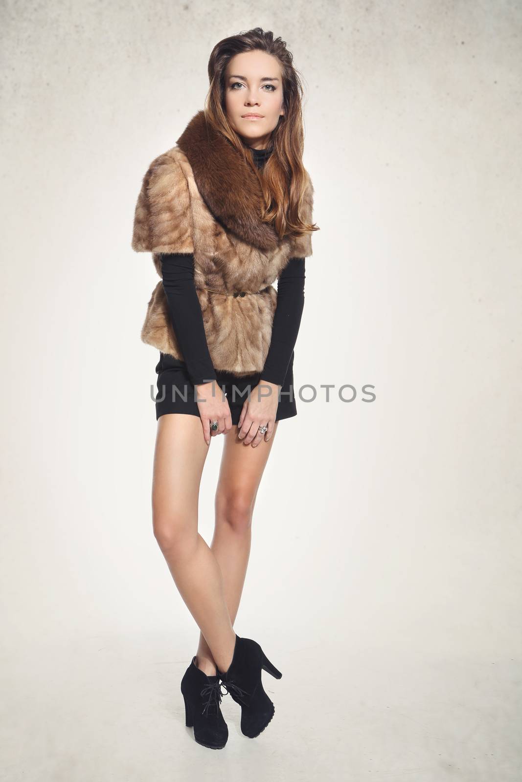 Fashion model in a fashionable vest with fur