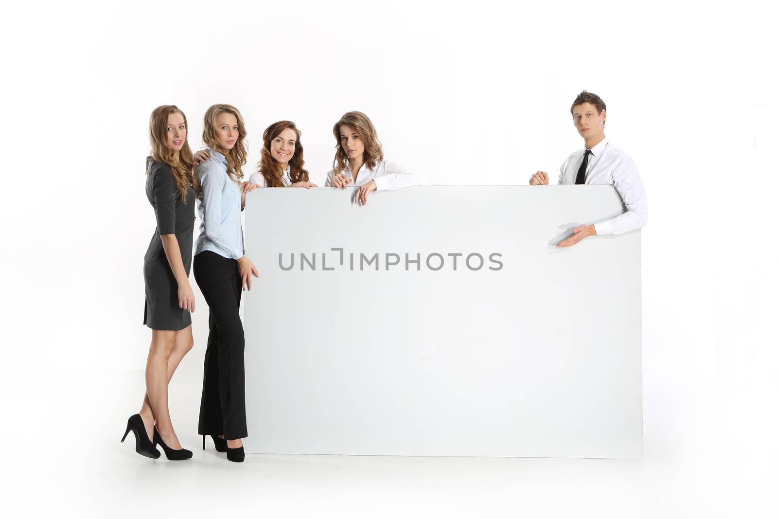 A group of young businessmen with whiteboards by robert_przybysz
