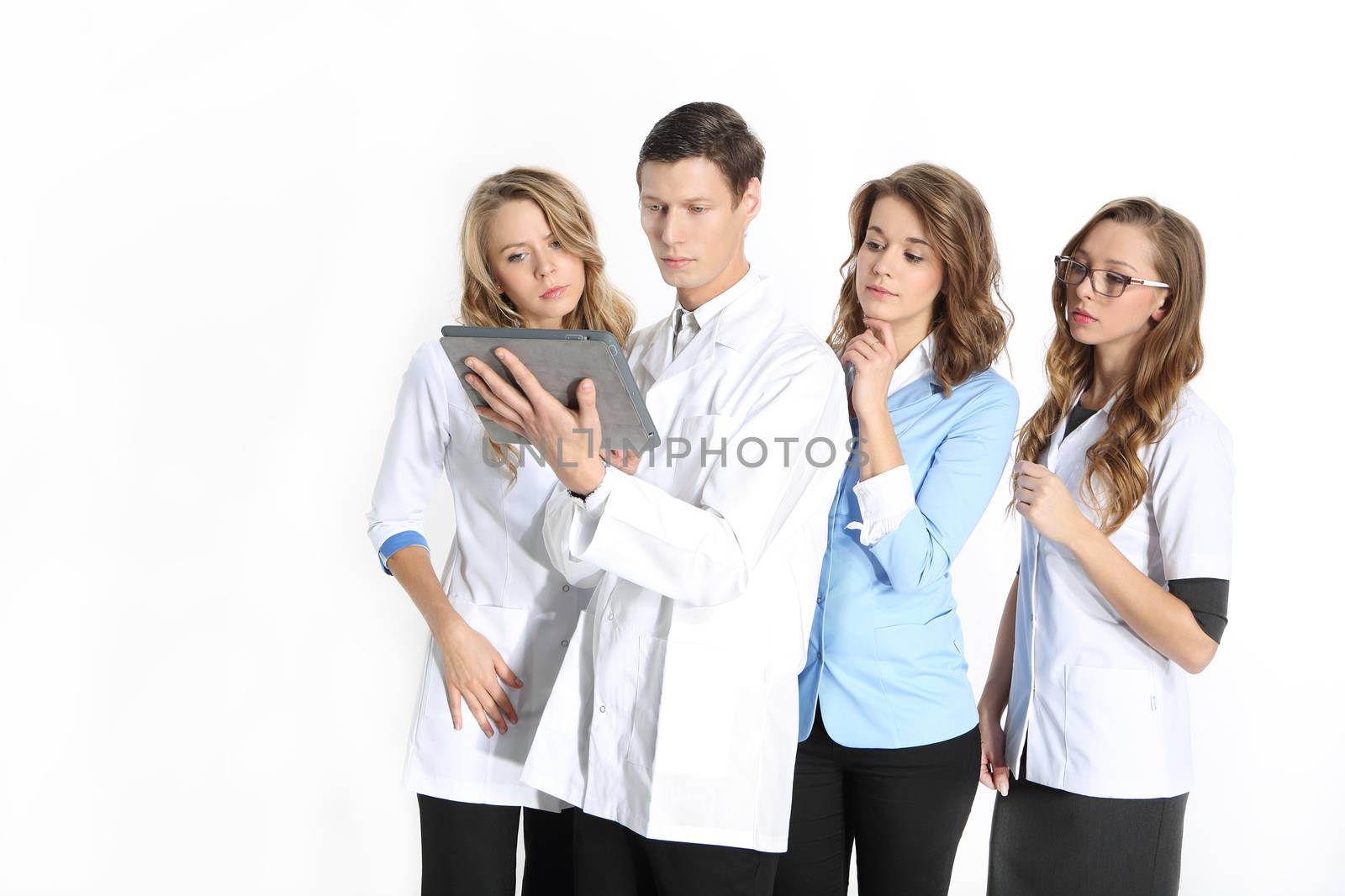 Four young attractive doctors in white, blue aprons on a white background