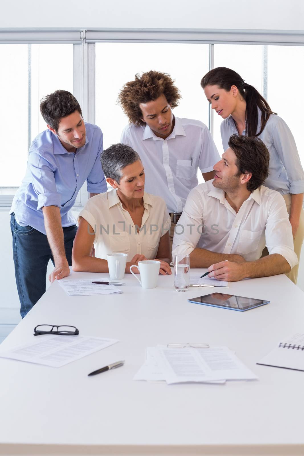 Attractive business people working together in the workplace