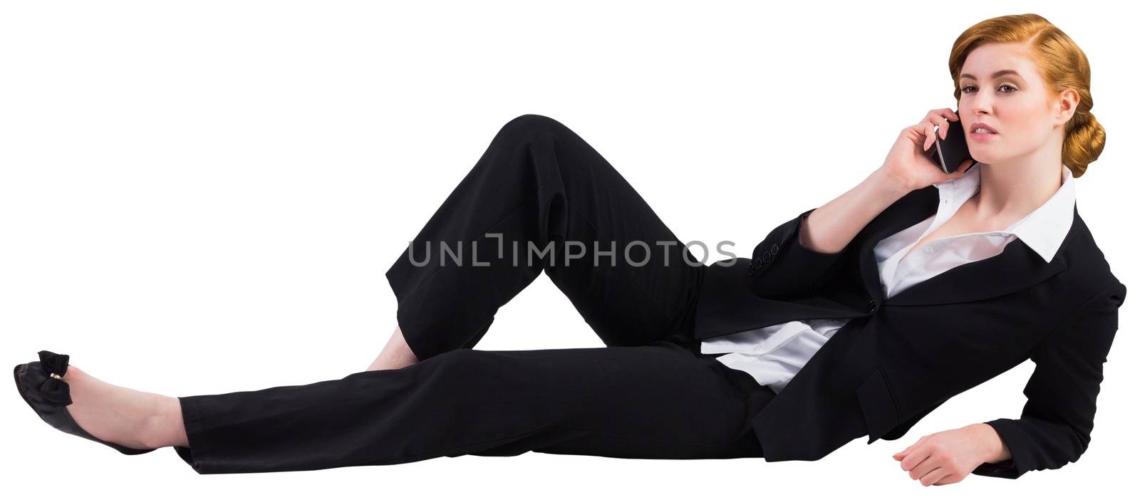 Redhead businesswoman on the phone on white background