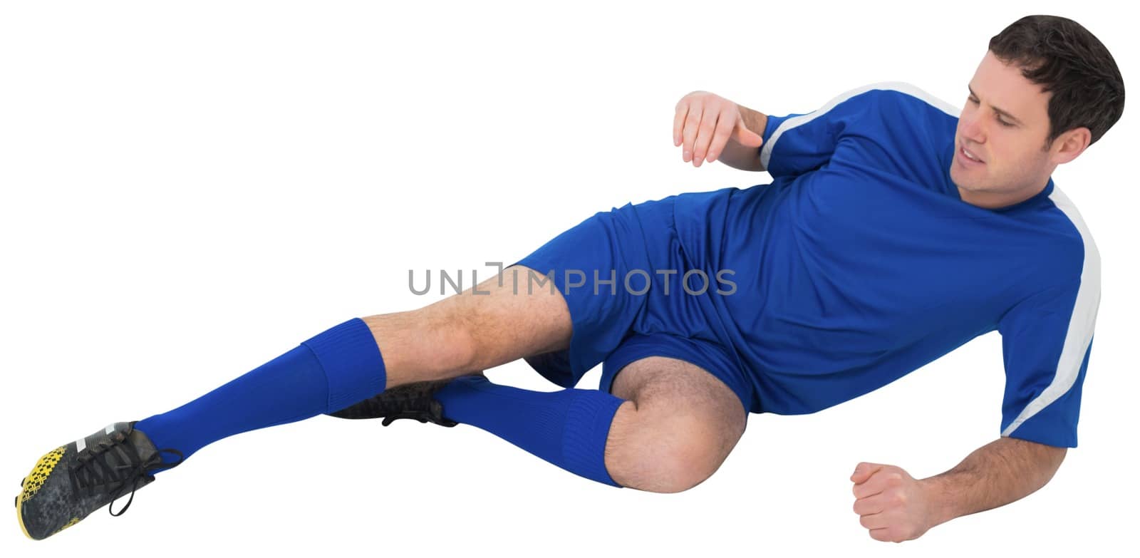Football player in blue kicking by Wavebreakmedia