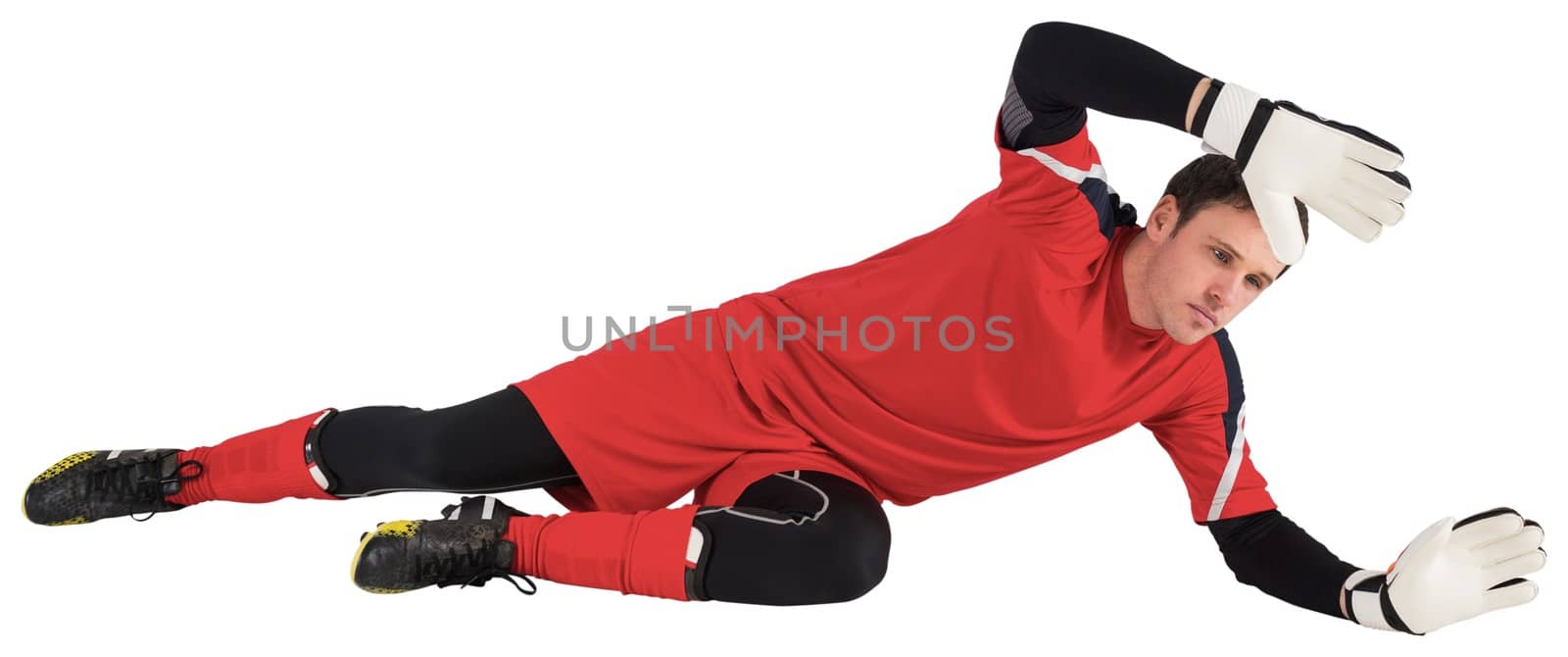 Fit goal keeper jumping up on white background