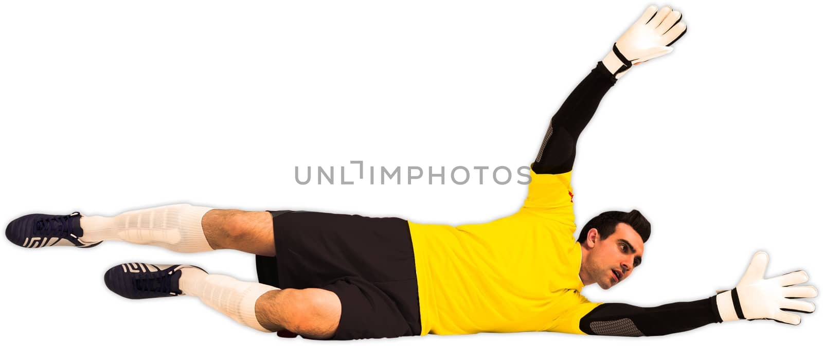 Goalkeeper in yellow making a save on white background