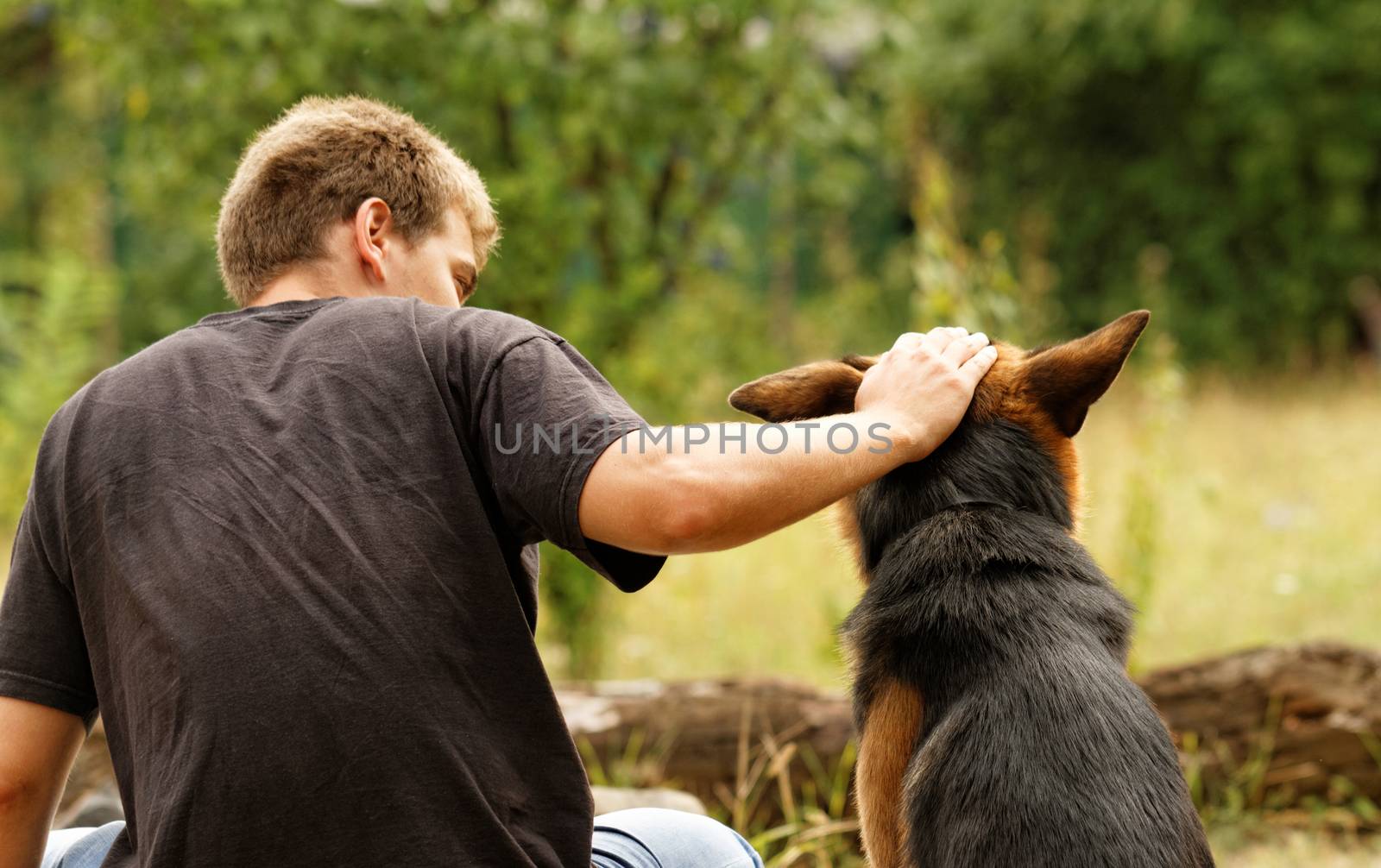 Photo of a beautiful friendship with a boy and a dog