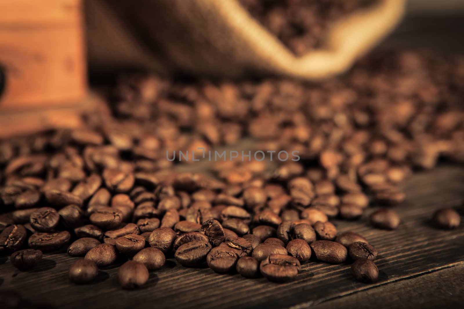 close up of coffee beans on a wooden table