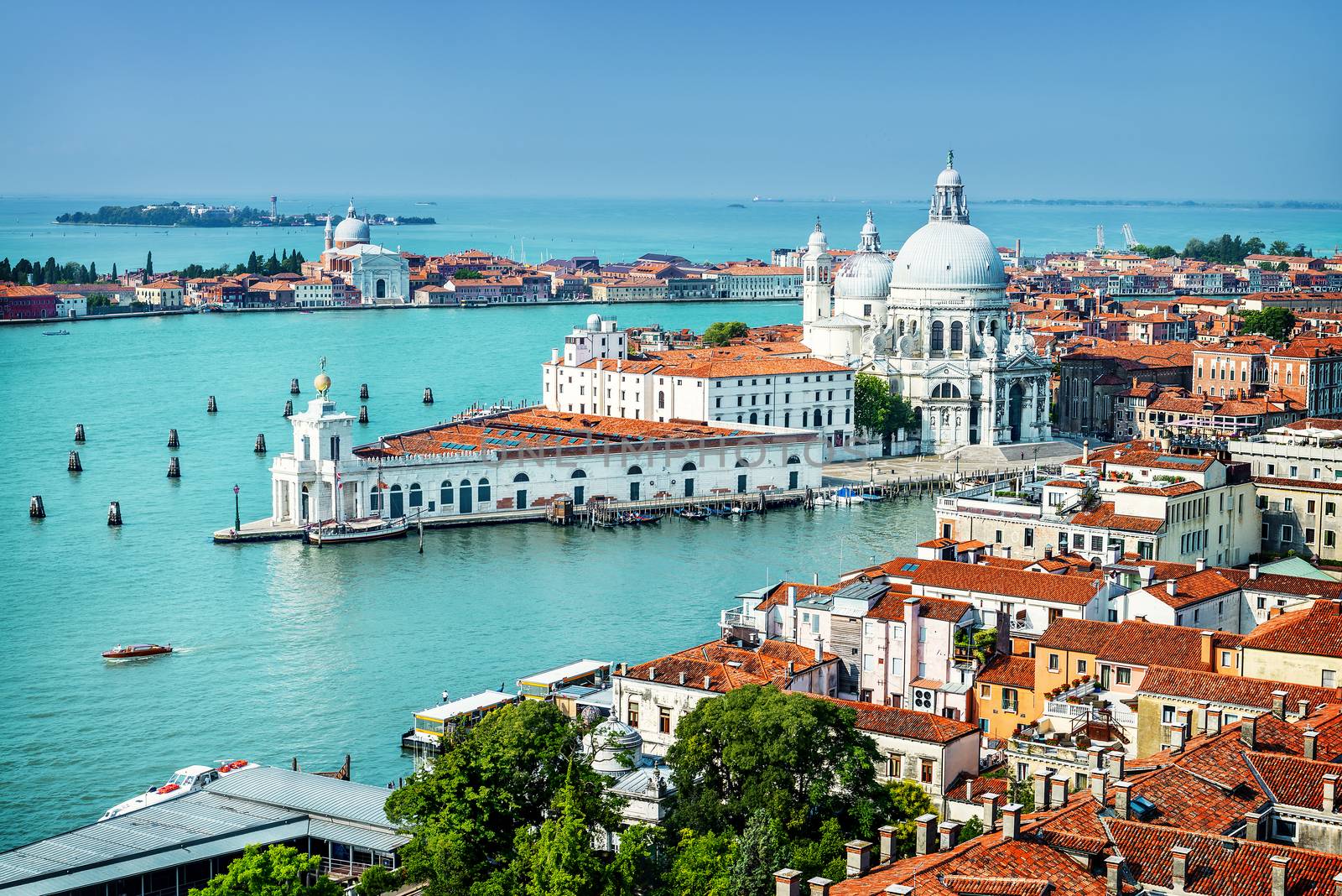 Beautiful view of the Grand Canal and Basilica Santa Maria della Salute in the late evening with very interesting clouds, Venice, Italy 