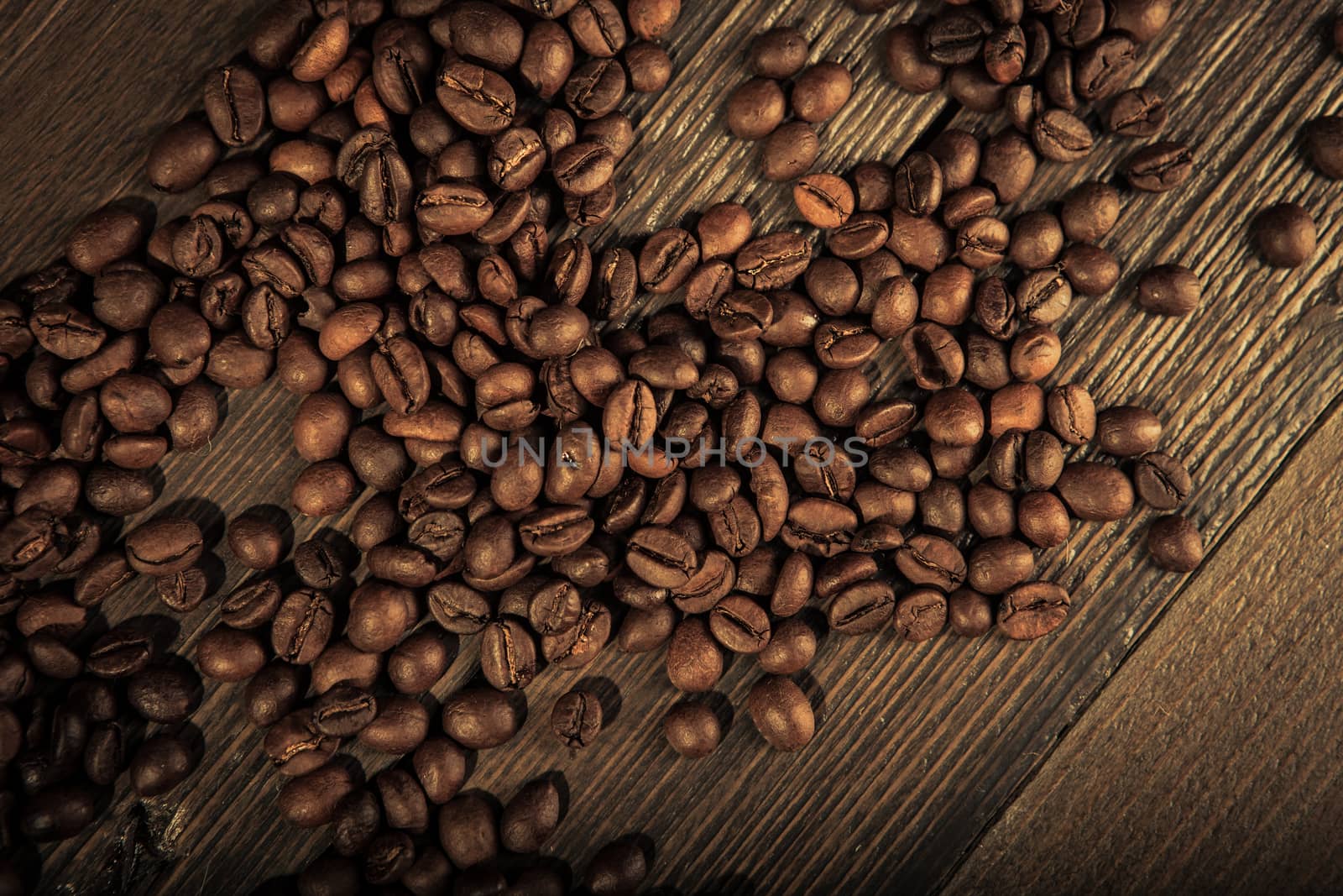 close up of coffee beans on a wooden table