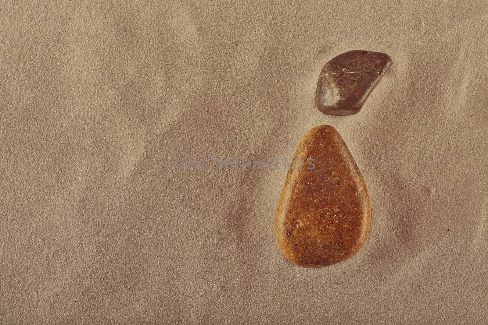 stones on sand that look like a pear