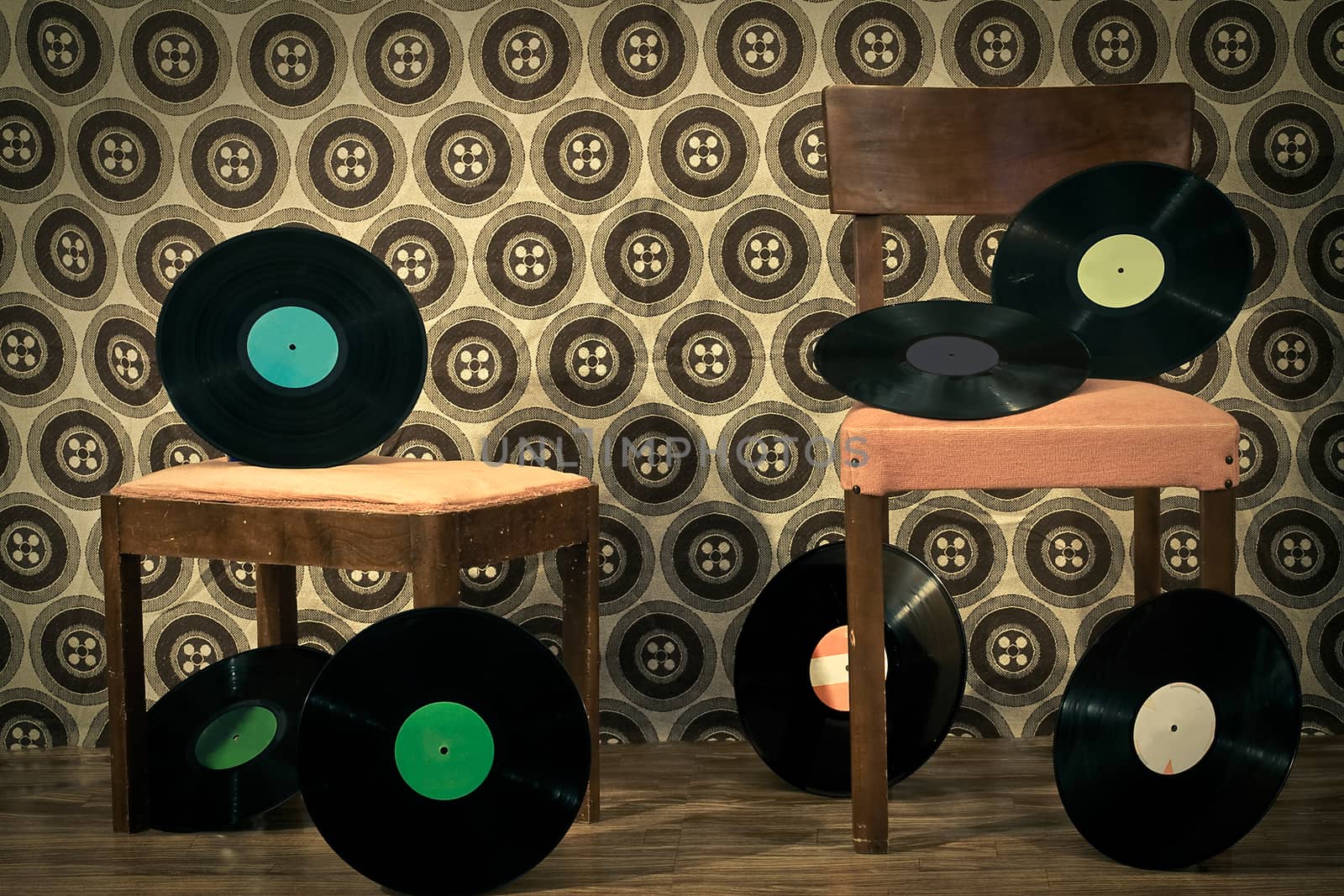 retro room full with 33rpm discs on chair and footrest