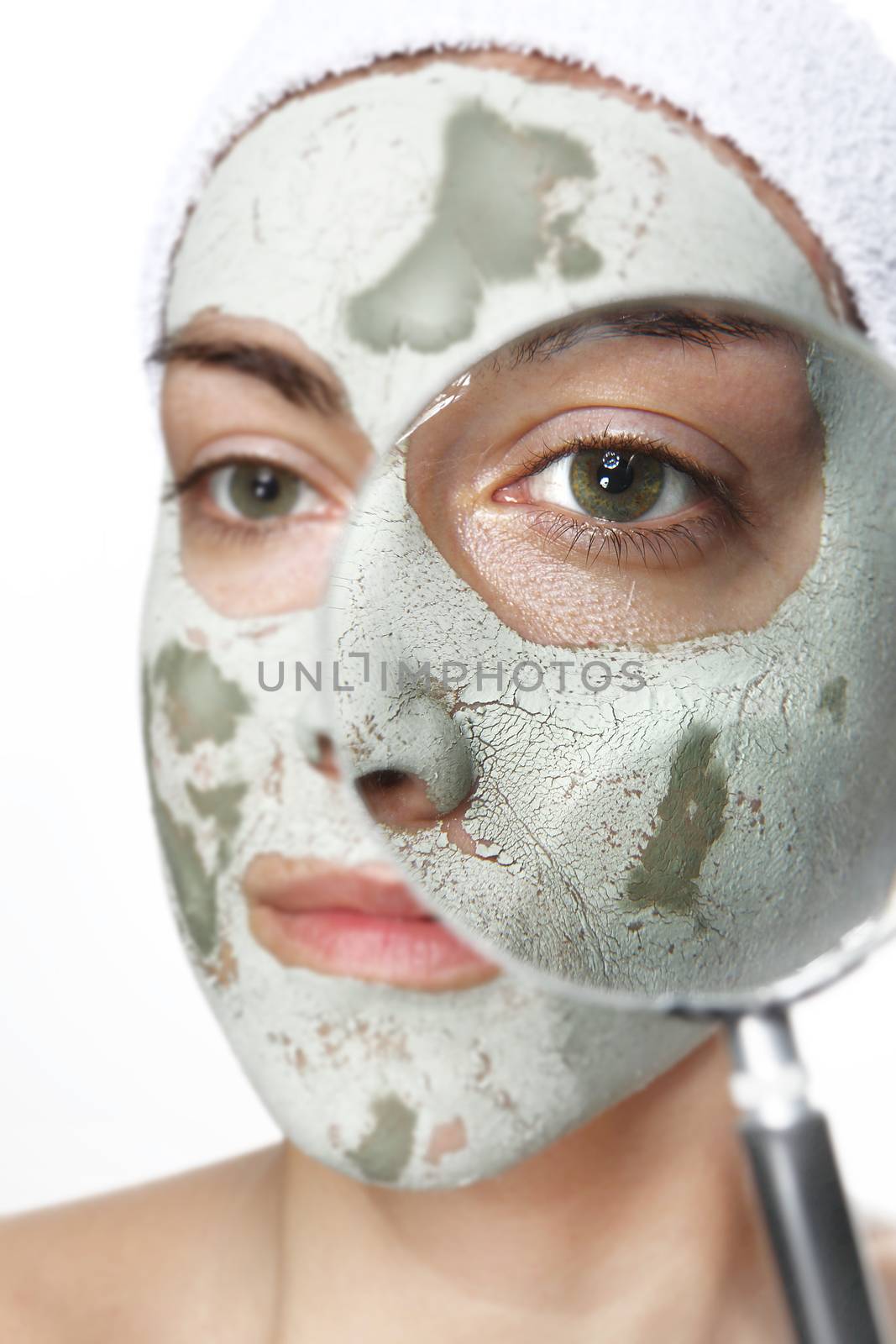 Green mask and magnifying glass