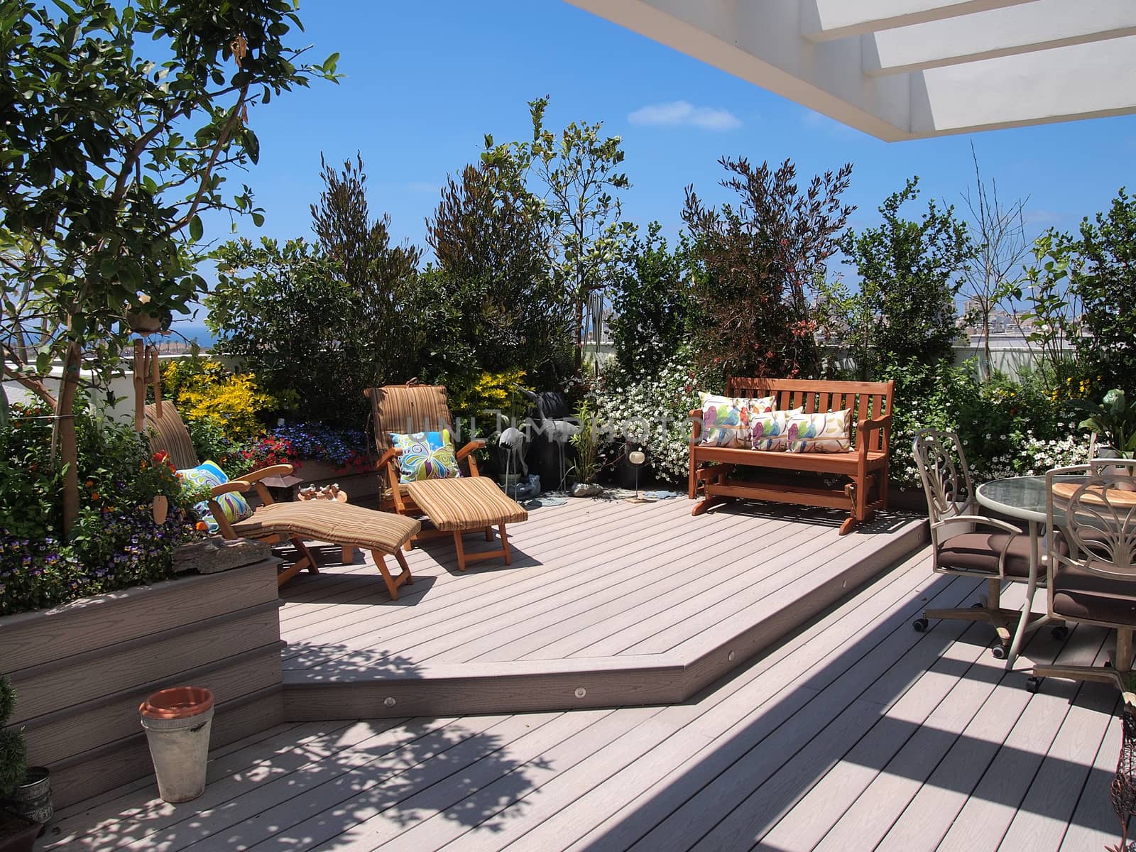 Beautiful classical design blooming rooftop garden in city urban setting