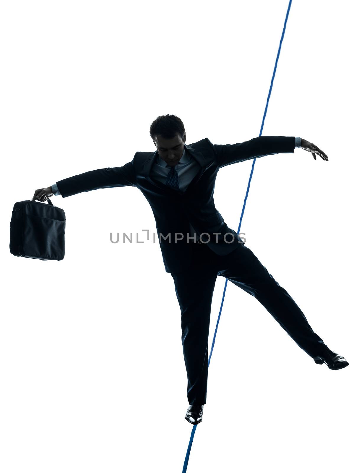 one caucasian Businessman tightrope walker in silhouette studio isolated on white background