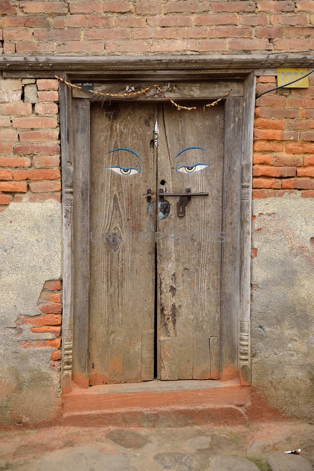 The door at Kokhana Village, Kathmandu, Nepal by think4photop