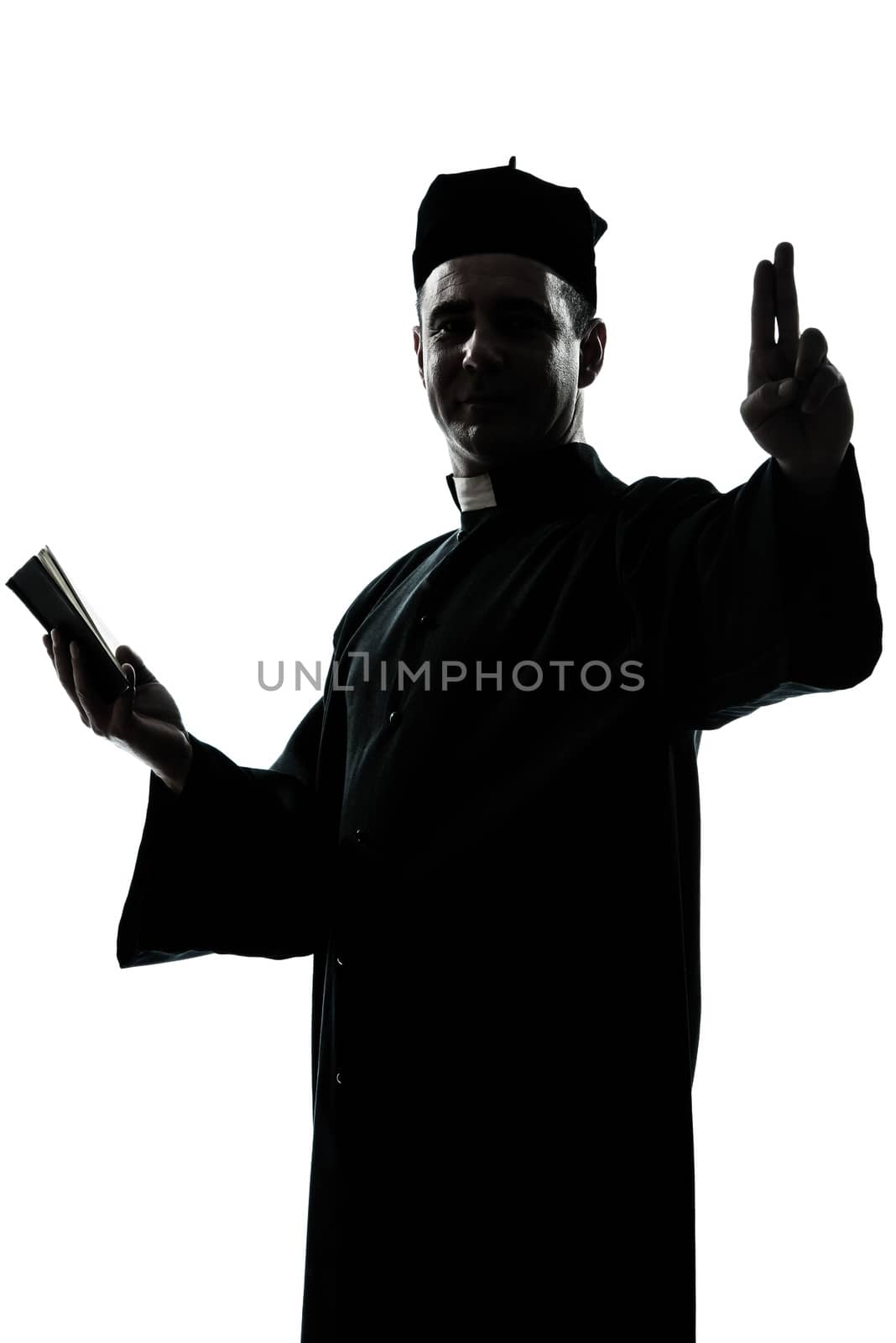one caucasian man priest silhouette in studio isolated on white background