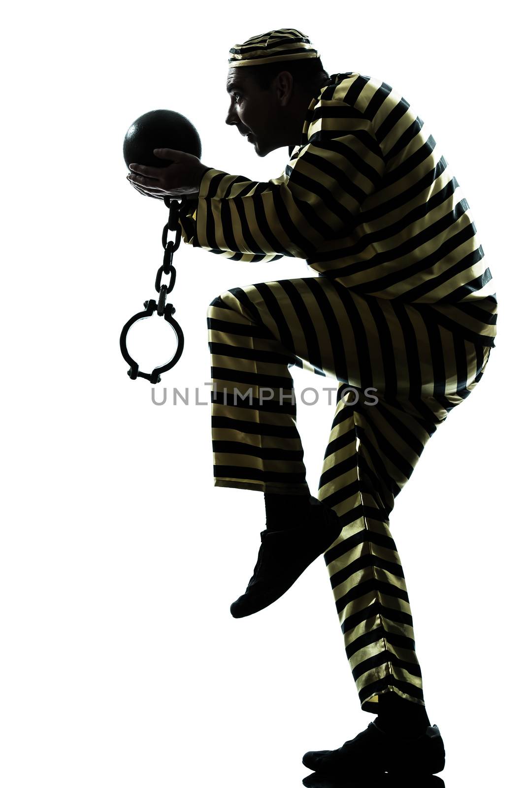 one caucasian man prisoner criminal escaping with chain ball silhouette in studio isolated on white background
