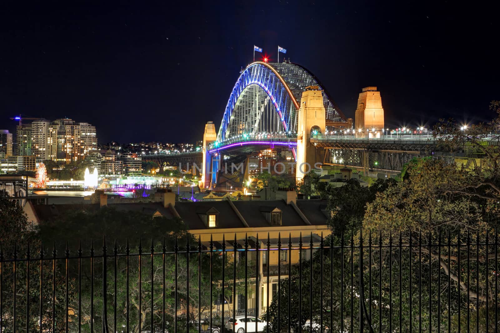 SYDNEY, NSW, AUSTRALIA - JUNE 3, 2014;  Sydney Harbour Bridge during Vivid Sydney from Observatory Hill.  View North across the harbour to North Sydney.  Long  exposure 
