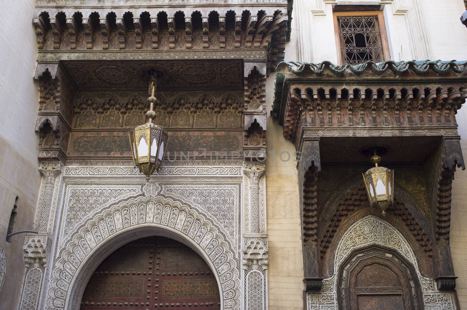 Ornate entrance to the historic Kairaouin Mosque deep inside the medina of Fes in Morocco.