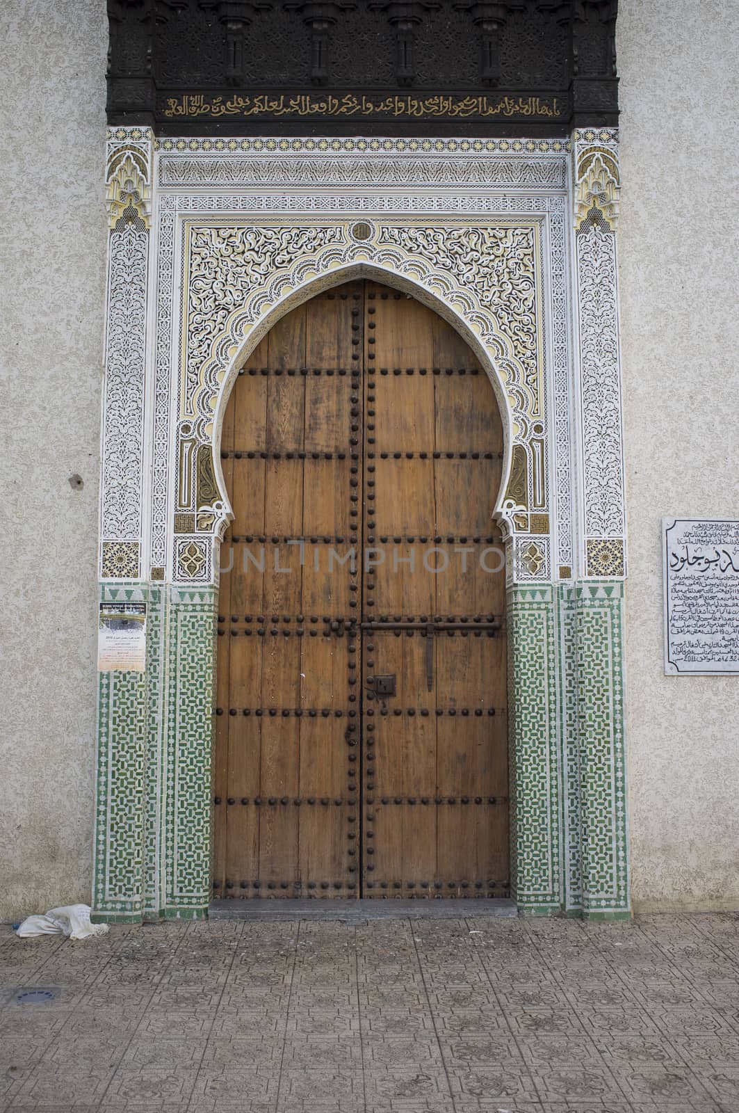 Traditional islamic keyhole shaped door in the historic medina in the ancient city of Fes in Morocco