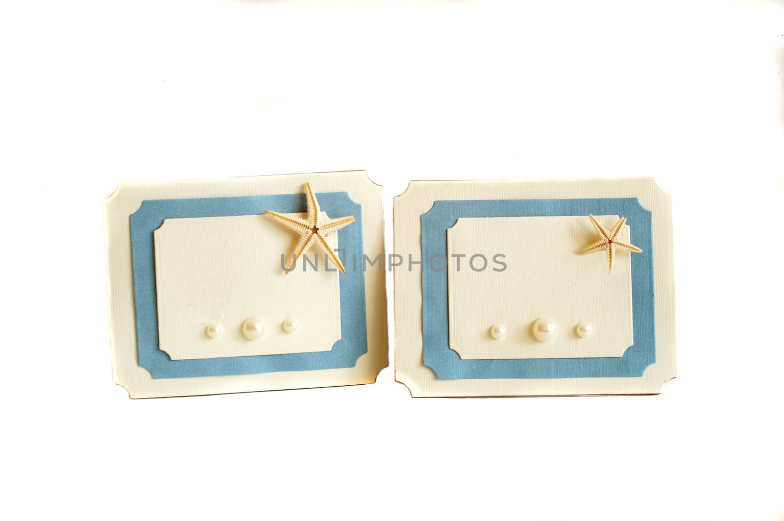 Two blue and white card with a sea star and pearls                               