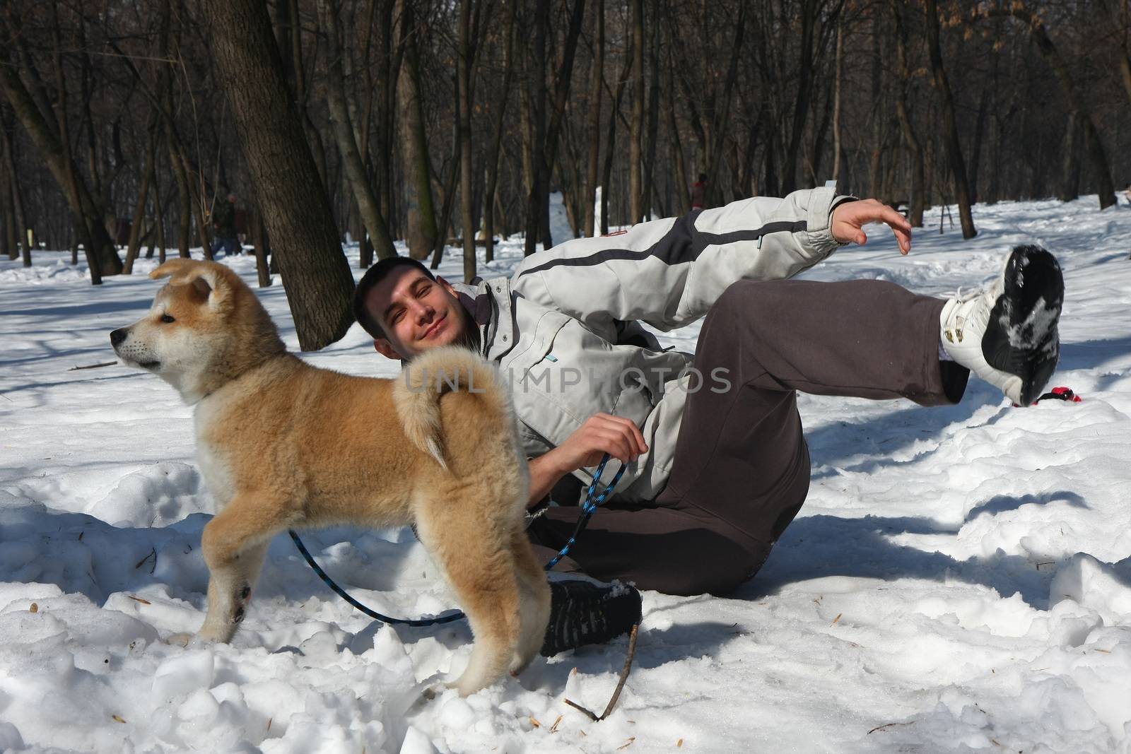 Asuko,my puppie of Japanese dog Akita Inu, with my son ,Belgrade,Serbia.First steps on the snow.