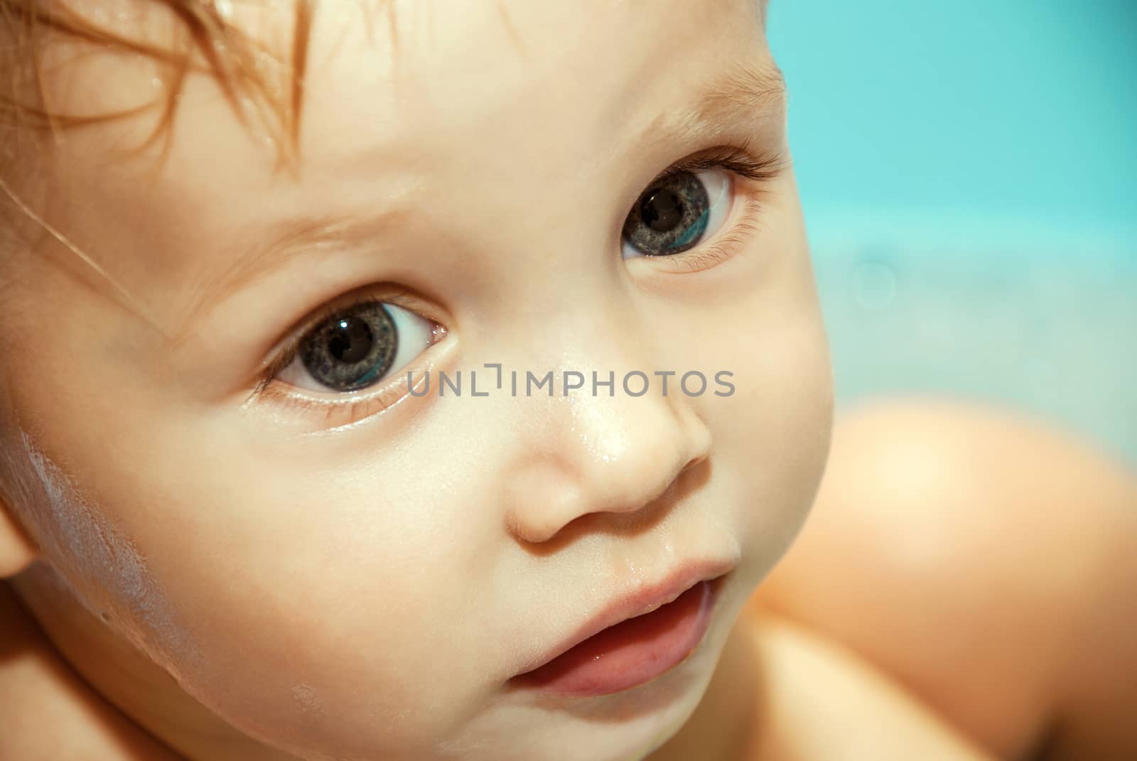 Closeup portrait of funny young boy.