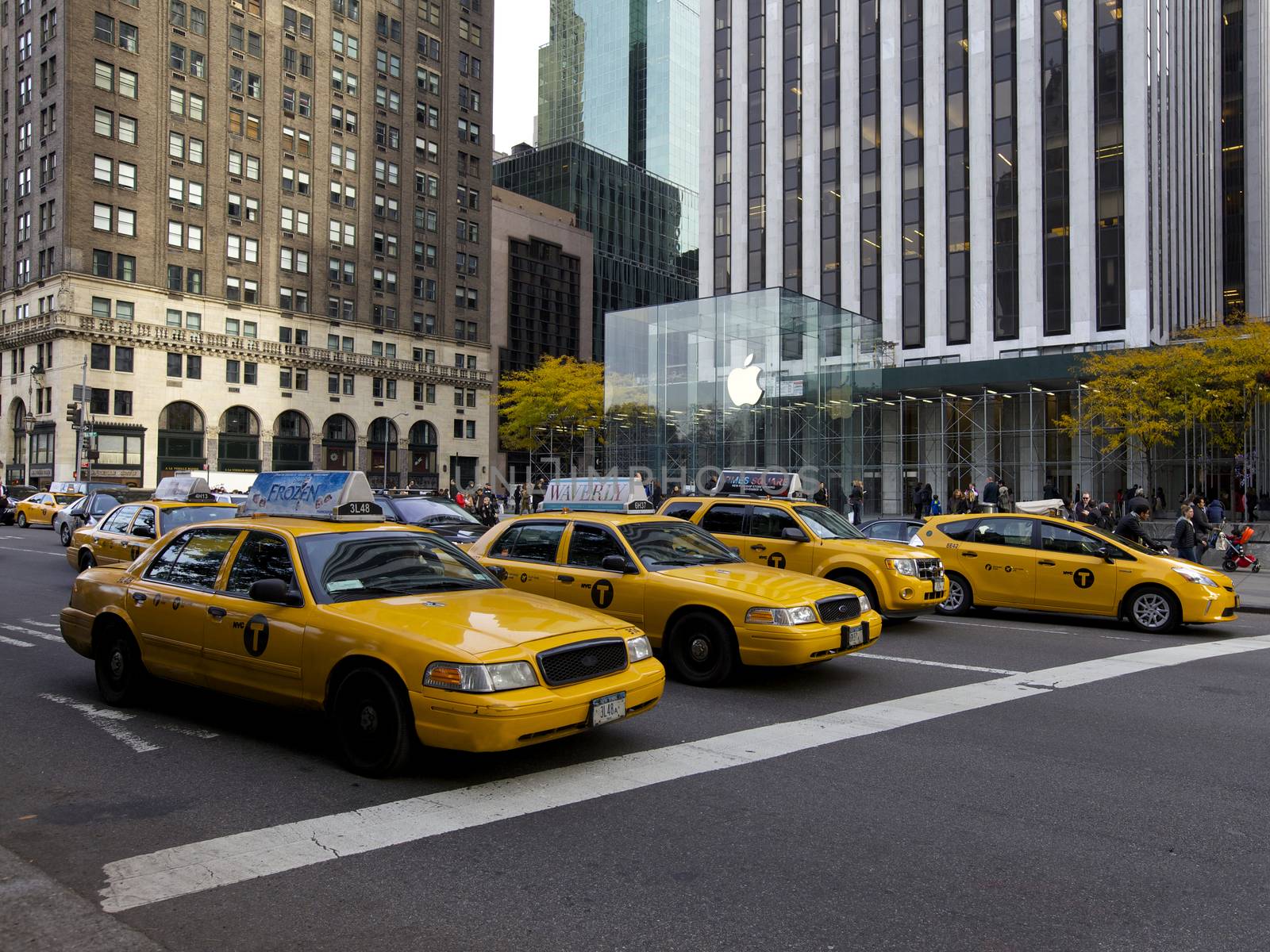 Yellow Cabs in front of Apple Store in New York, USA