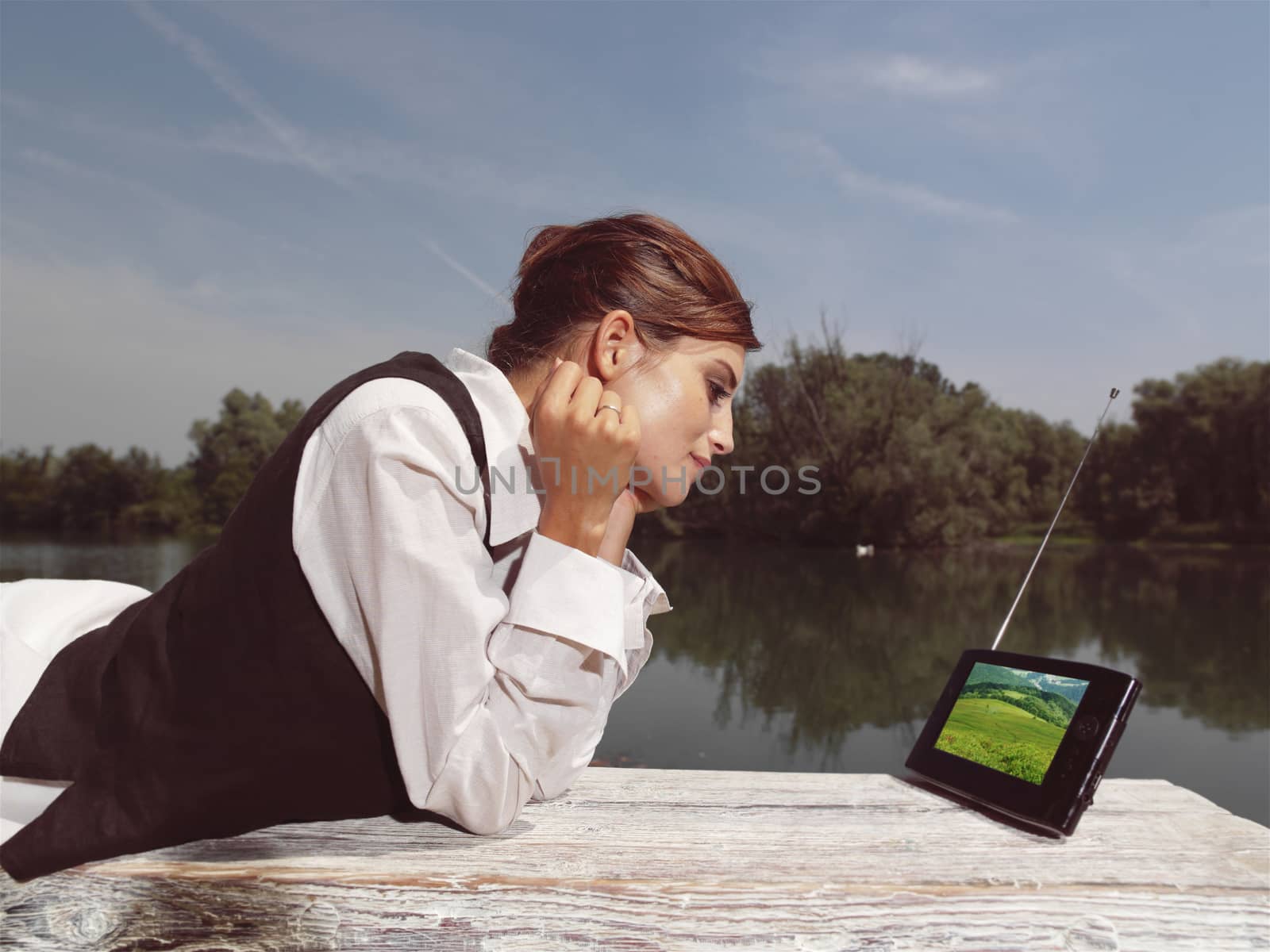 a woman with laptop in park by toocan