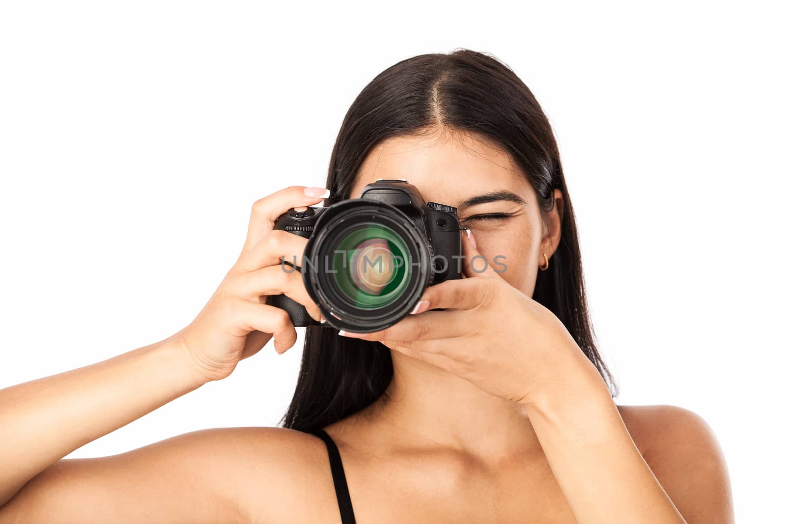 Closeup portrait of a young woman holding a camera by photobac