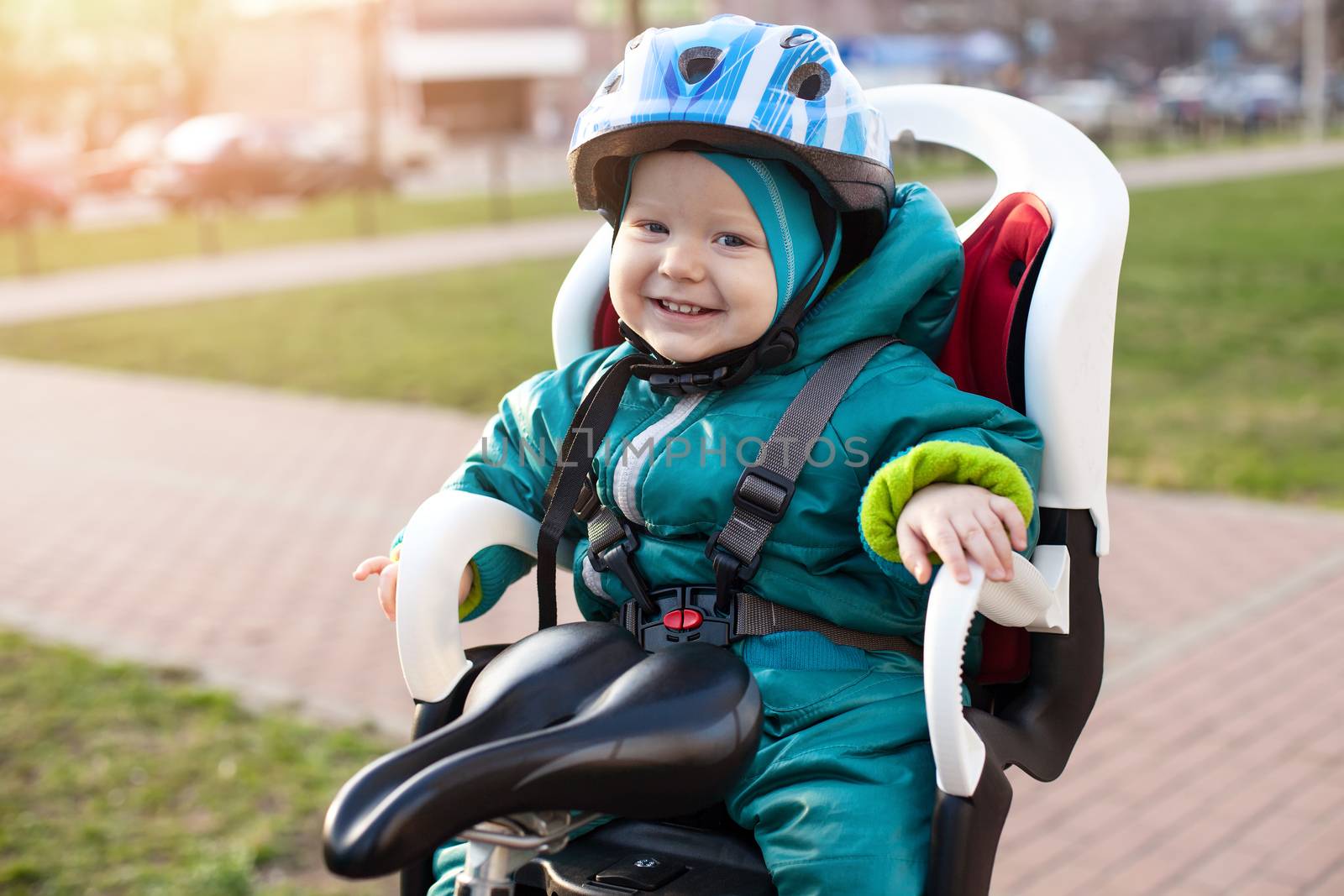 Little boy in a bike seat by photobac