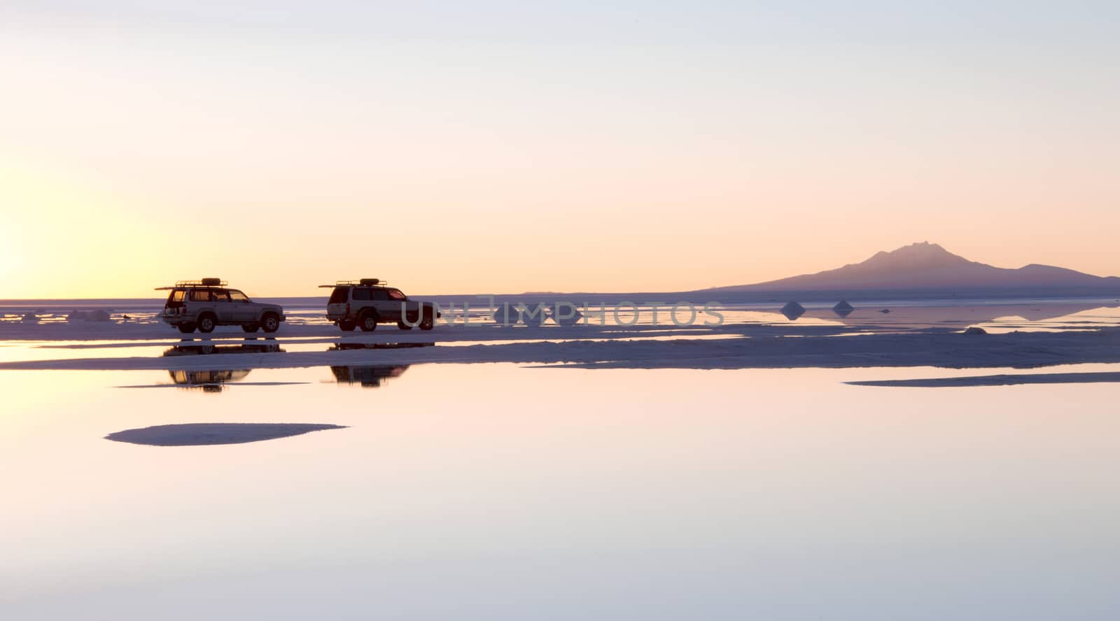 SALAR DE UYUNI, BOLIVIA - JULY 24: The car on the salt lake of Uyuni, July 24, 2011. Salar de Uyuni is located at an altitude of 4000 meters above sea level on the Altiplano plateau 