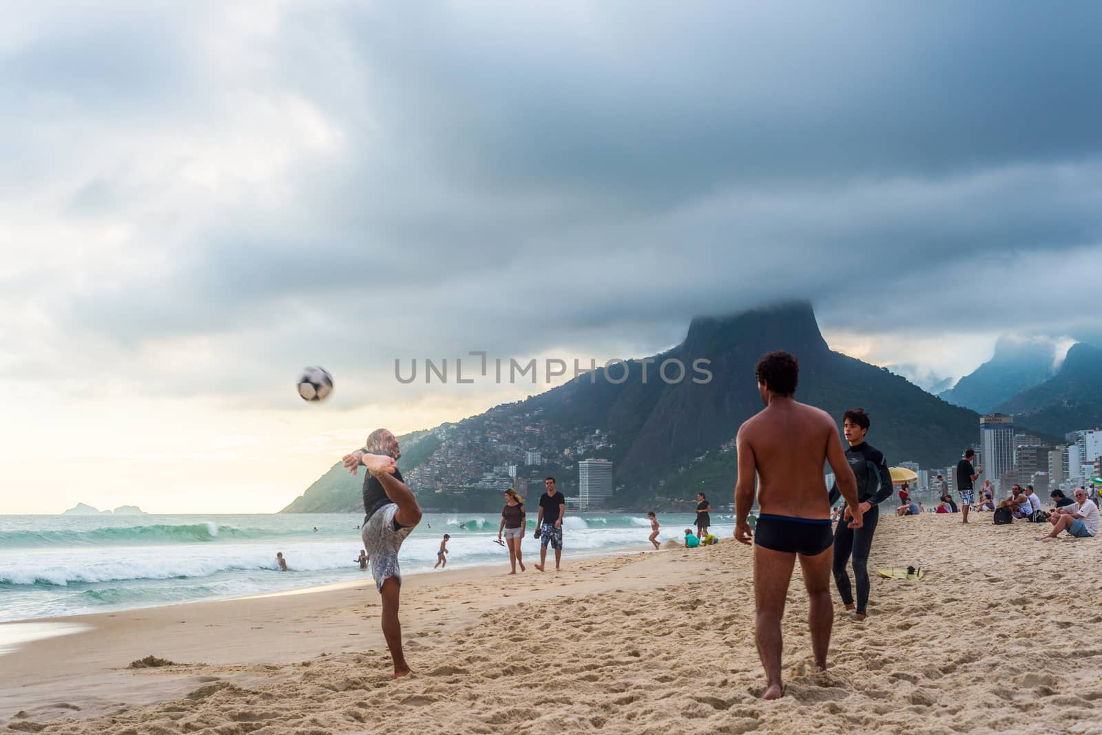 RIO DE JANEIRO, MARCH 2: Group of Brazilians play a game of keepie-uppie football (known locally as altinho) on the shore of Ipanema Beach - march 2, 2013 in Rio de Janeiro, Brazil