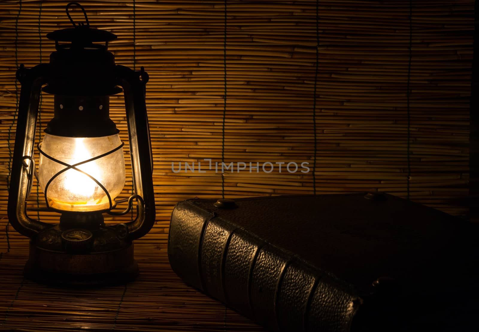 Set with an old rusty lantern and a book by enrico.lapponi