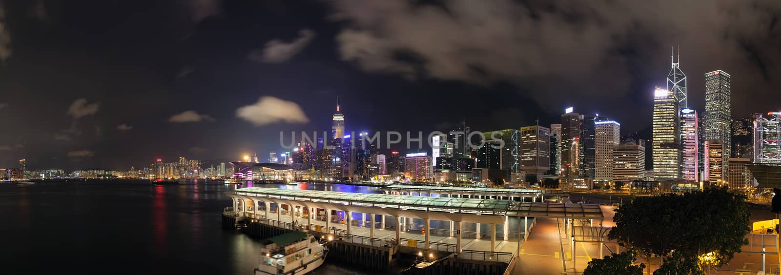 Hong Kong Central Ferry Pier with City Skyline at Night Panorama