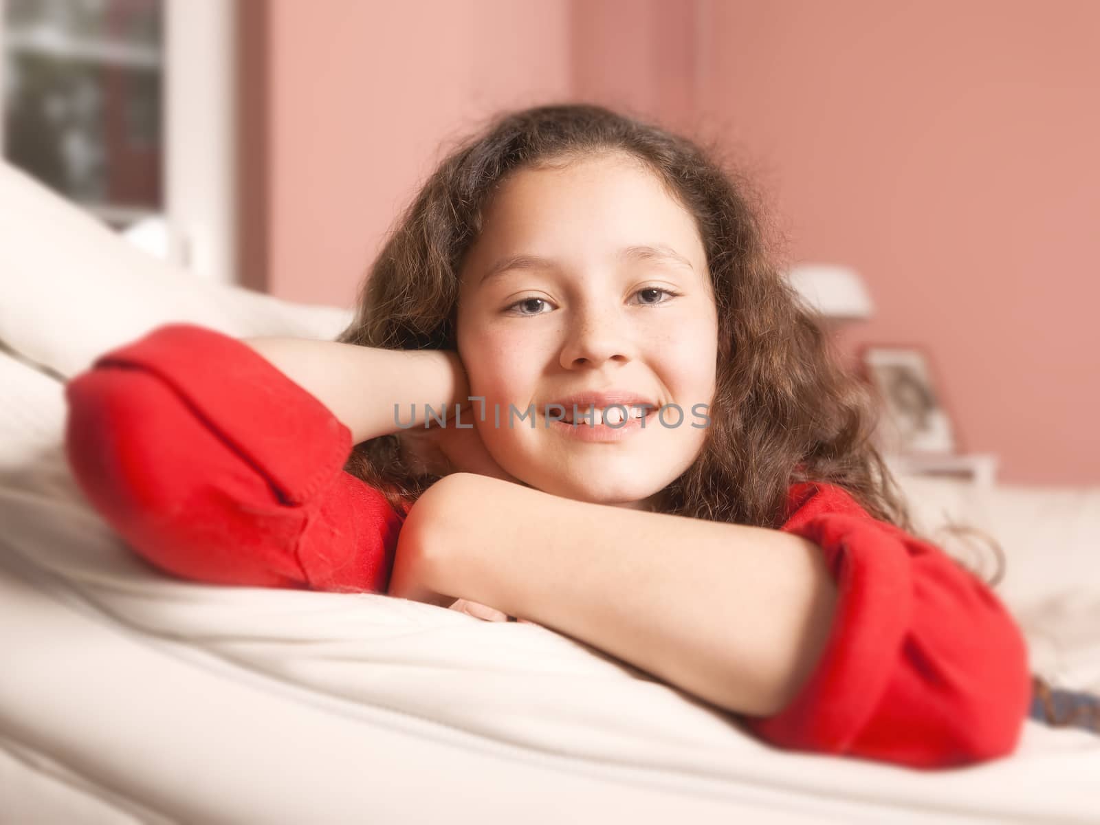 An image of a girl relaxing at the sofa