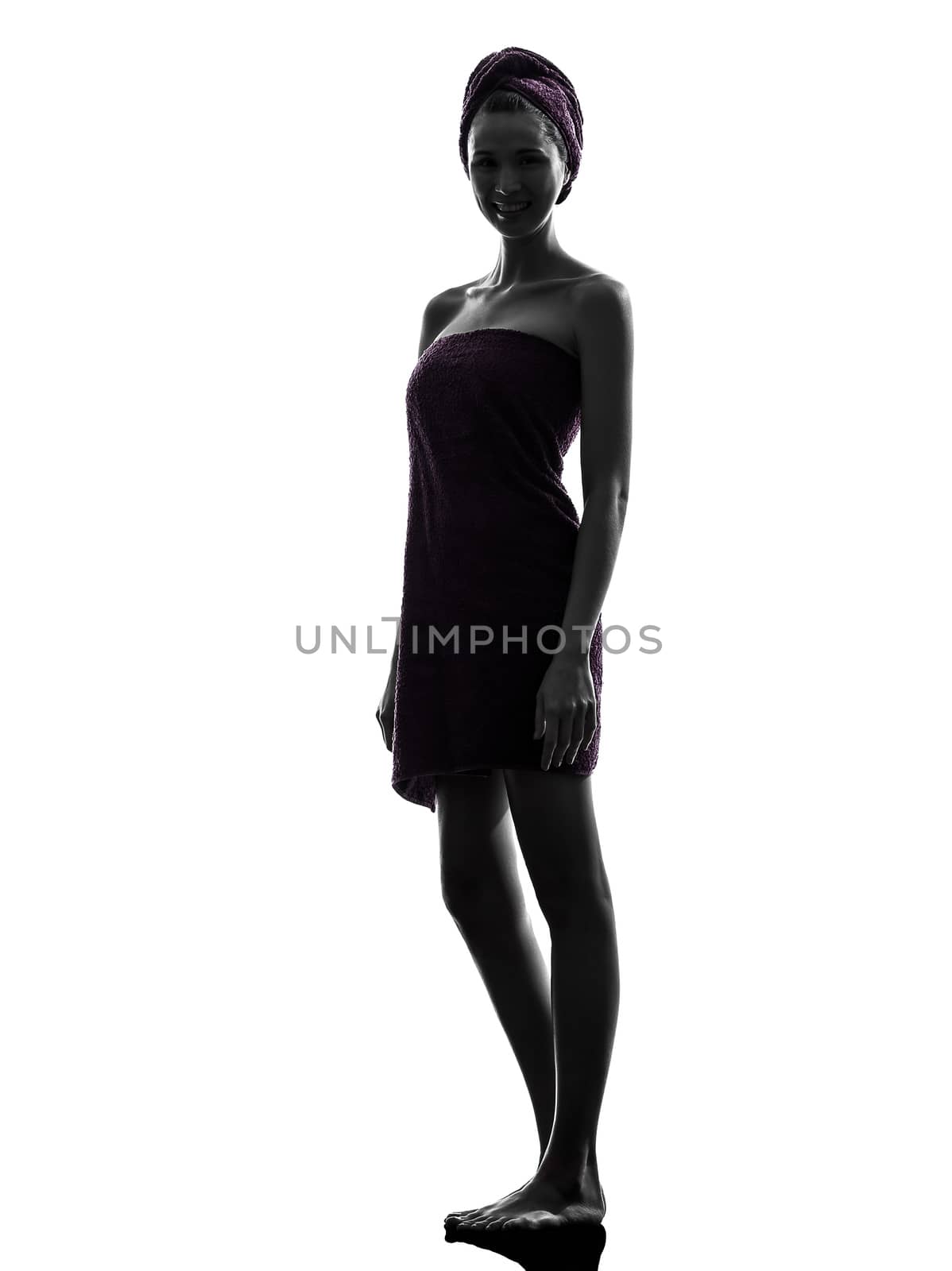 one beautiful asian young woman wrapped towel in silhouette studio isolated on white background