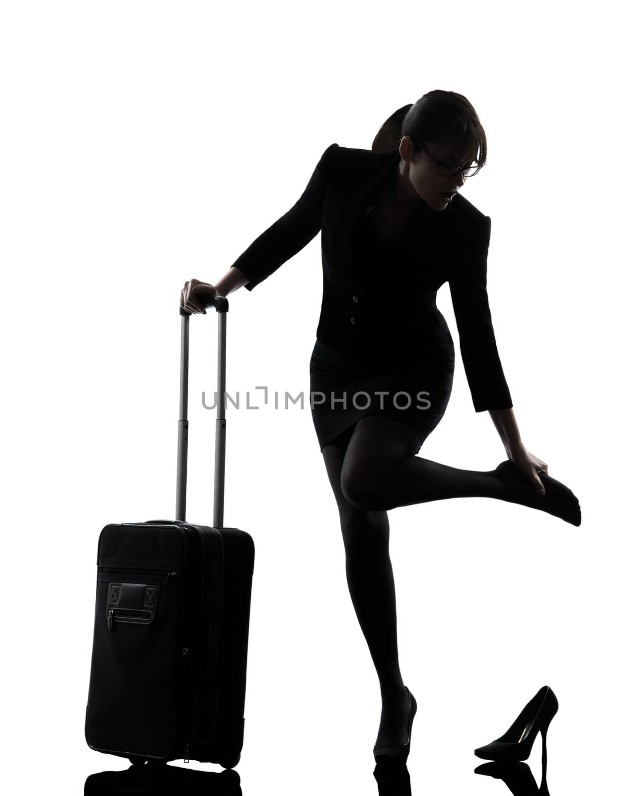 one business woman traveling massaging feet silhouette studio isolated on white background