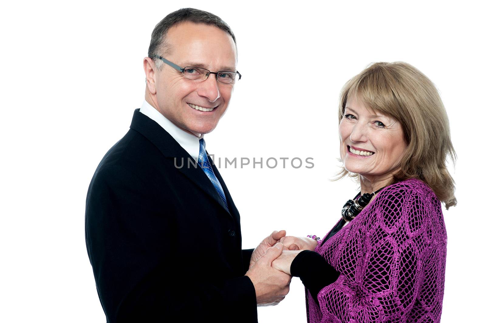 Couple in love, holding hands. by stockyimages