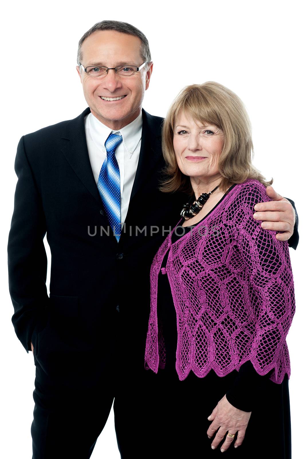Adorable smart happy senior couple by stockyimages
