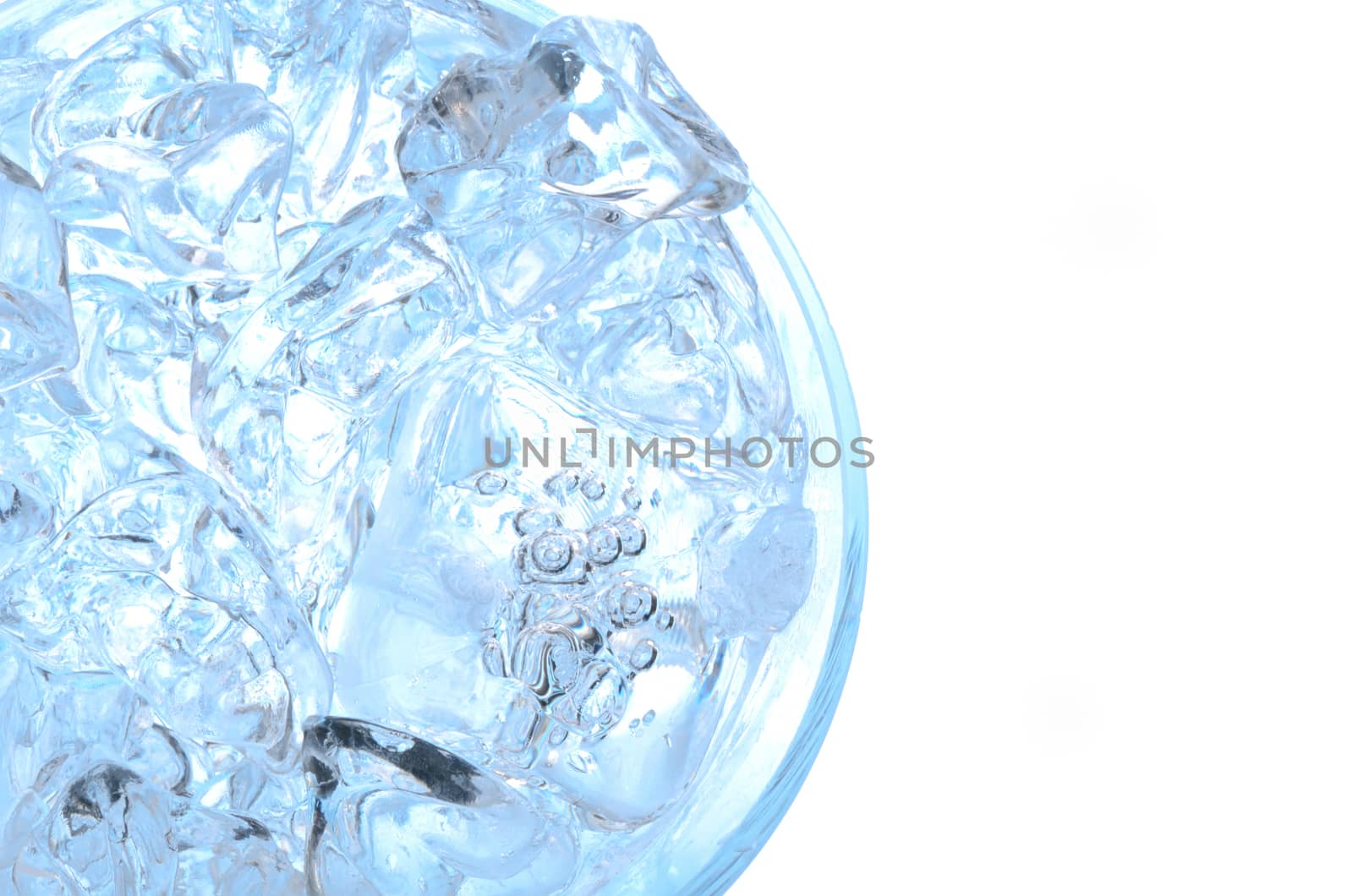 Water with ice in a glass, above view, isolated on white