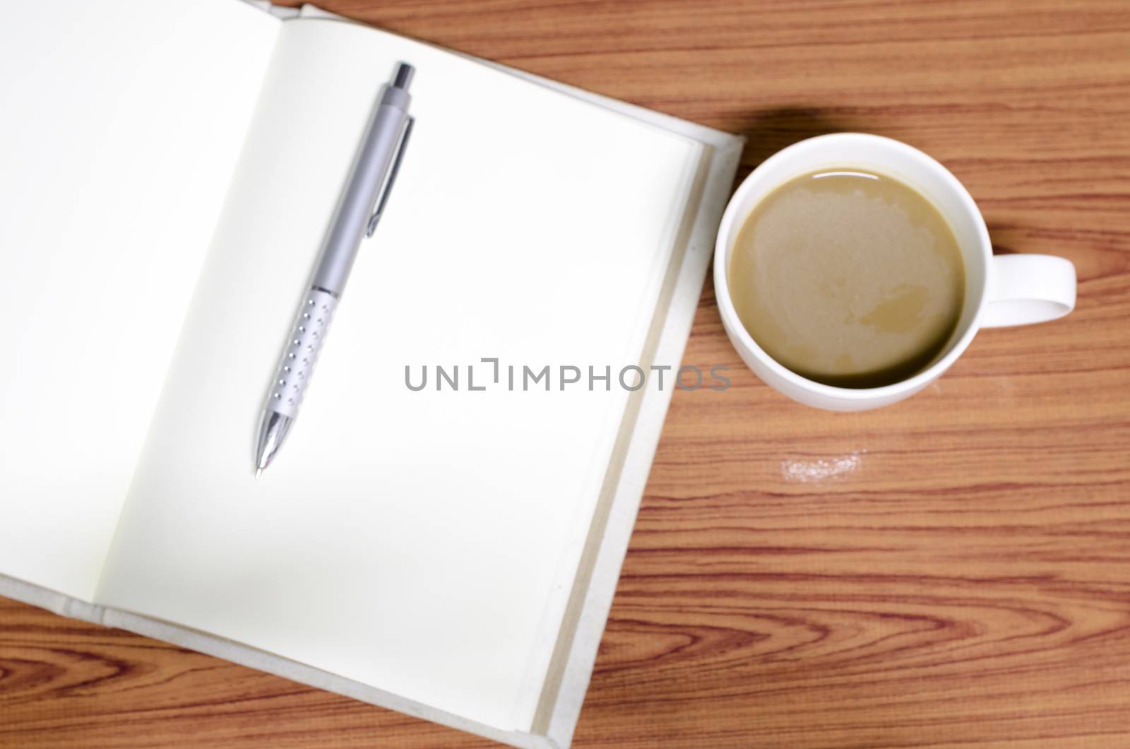 coffee and notebook on wood background concept coffee time