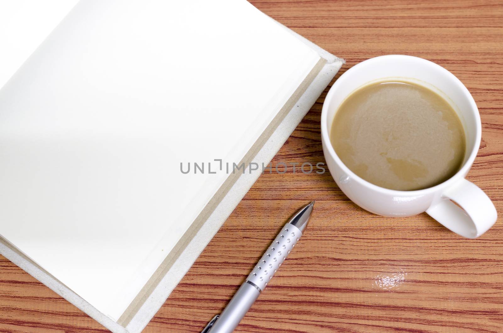 coffee and notebook on wood background concept coffee time