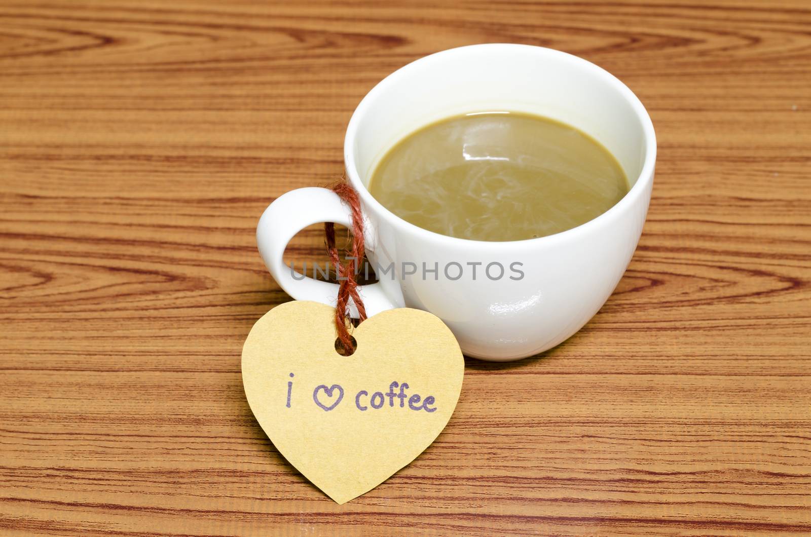 coffee cup with heart tag write I love coffee word on wood background