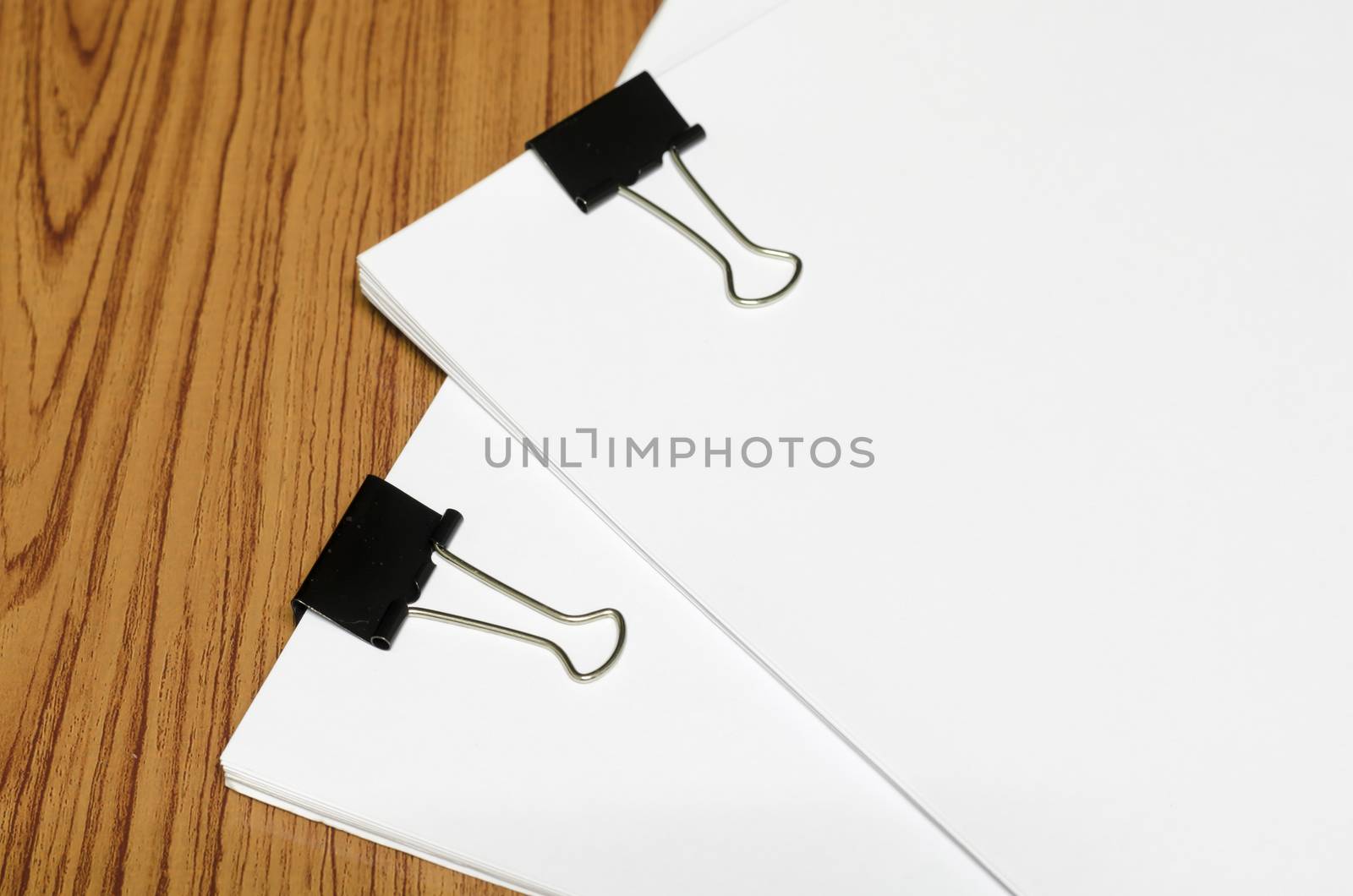 clip and paper on wood background