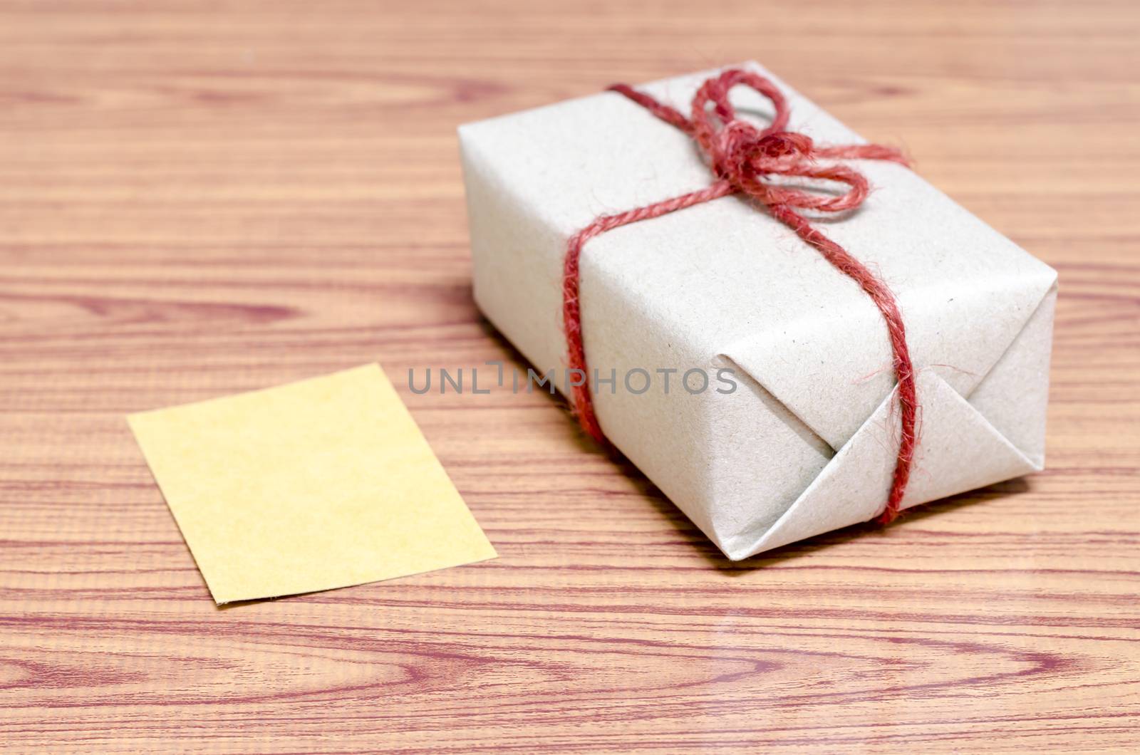 brown gift box and card on wood background